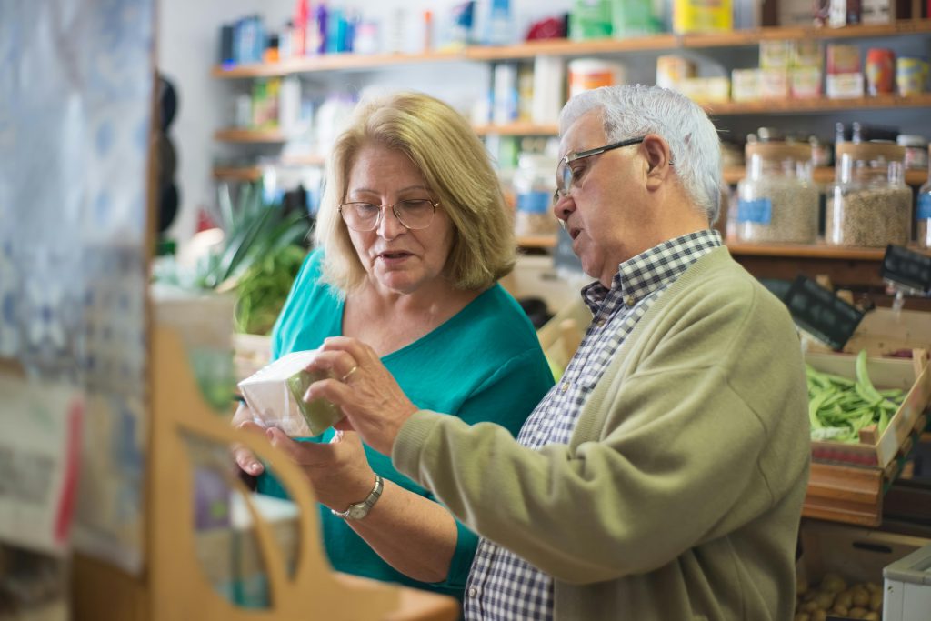 Older couple shopping at store